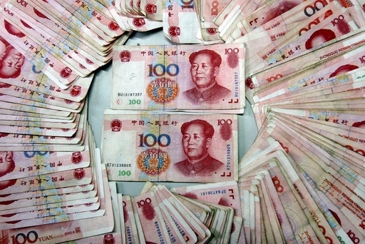 中国、人民元建て決済を試験導入へ 国際通貨めざす動きか
