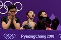 平昌冬季五輪、フィギュアスケート・ペアのショートプログラム（SP）を終え、得点に反応する北朝鮮の廉太鈺/金柱希組（2018年2月14日撮影）。(c)AFP/ARIS MESSINIS