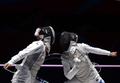 ロンドン五輪は28日、エクセル（ExCeL London）でフェンシングの女子フルーレ個人決勝が行われ、イタリアのエリーザ・ディフランチェスカ（Elisa Di Francisca）が12-11でイタリアのアリアンナ・エッリゴ（Arianna Errigo）に勝利し、金メダルを獲得した。

決勝で対戦するアリアンナ・エッリゴ（左）とエリーザ・ディフランチェスカ（2012年7月28日撮影）。(c)AFP/TOSHIFUMI KITAMURA