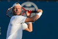 テニス、ロジャーズ・カップ、男子ダブルス1回戦。リターンを狙うレイトン・ヒューイット（2015年8月11日撮影）。(c)AFP/Getty Images/Minas Panagiotakis