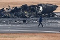 日本航空（JAL）の旅客機と衝突した海上保安庁の航空機。東京国際（羽田）空港で（2024年1月3日撮影）。(c)Richard A. Brooks / AFP