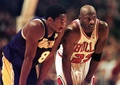 Los Angeles Lakers guard Kobe Bryant(L) and Chicago Bulls guard Michael Jordan(R) talk during a free-throw attempt during the fourth quarter 17 December at the United Center in Chicago. (c)AFP/VINCENT LAFORET
