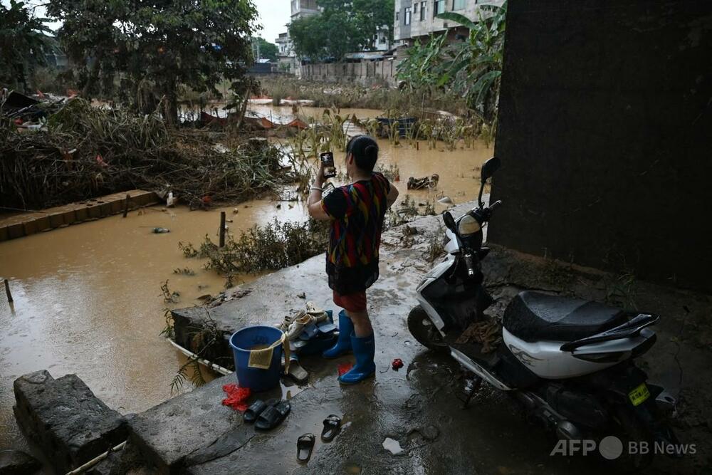 中国南部洪水で39人死亡、復旧作業進む中で新たな台風接近 写真6枚
