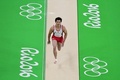 リオデジャネイロ五輪、体操男子予選。跳馬の演技に臨む山室光史（2016年8月6日撮影）。(c)AFP/Emmanuel DUNAND