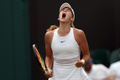 テニス、ウィンブルドン選手権、女子シングルス3回戦。ガッツポーズを見せるミラ・アンドレーワ（2023年7月9日撮影）。(c)Adrian DENNIS / AFP