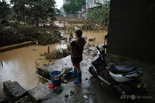 中国南部洪水で39人死亡、復旧作業進む中で新たな台風接近 写真6枚