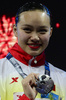 第15回世界水泳選手権（15th FINA World Championships）は24日、スペイン・バルセロナ（Barcelona）でシンクロナイズドスイミングのソロフリールーティン（FR）決勝が行われ、ロシアのスベトラナ・ロマシナ（Svetlana Romashina）が優勝した。

2位には中国の黄雪辰（Huang Xuechen）、3位にはスペインのオナ・カルボネール・バレステロ（Ona Carbonell Ballestero）が入った。

銅メダルを手にポーズをとる黄雪辰（2013年7月24日撮影）。(c)AFP/JAVIER SORIANO