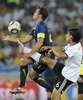 2010年サッカーW杯南アフリカ大会（%%2010 World Cup%%）1次リーグD組、ドイツ対オーストラリア。試合はドイツが4-0で快勝した。写真はオーストラリアのルーカス・ニール（%%Lucas Neill%%）とボールを競るドイツのサミ・ケディラ（%%Sami Khedira%%、右）。（2010年6月13日）(c)AFP/JAVIER SORIANO