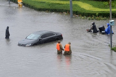 中国北部、集中豪雨で死者・不明者100人近くに
