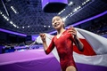 第19回アジア競技大会、体操女子種目別平均台決勝。優勝を喜ぶ岡村真（2023年9月29日撮影）。(c)Philip FONG / AFP