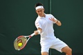 テニス、ウィンブルドン選手権（The Championships Wimbledon 2014）男子シングルス3回戦。リターンを打つ錦織圭（Kei Nishikori、2014年6月28日撮影）。(c)AFP/GLYN KIRK