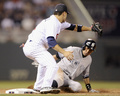 13MLB、ミネソタ・ツインズ（Minnesota Twins）対ニューヨーク・ヤンキース（New York Yankees）。三塁に滑り込むニューヨーク・ヤンキースのイチロー（Ichiro Suzuki、右、2013年7月1日撮影）。(c)AFP/Getty Images/Hannah Foslien