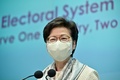 中国全国人民代表大会（全人代）で香港選挙制度の改革議案が可決された後、会見する香港の林鄭月娥（キャリー・ラム）行政長官（2021年3月11日撮影）。(c)Anthony WALLACE / AFP