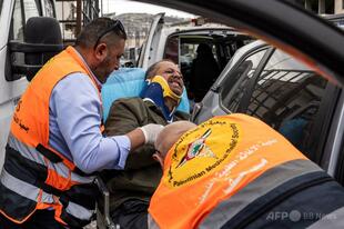 取材中のAFPカメラマン、イスラエル人入植者からの暴行で病院搬送 ヨルダン川西岸