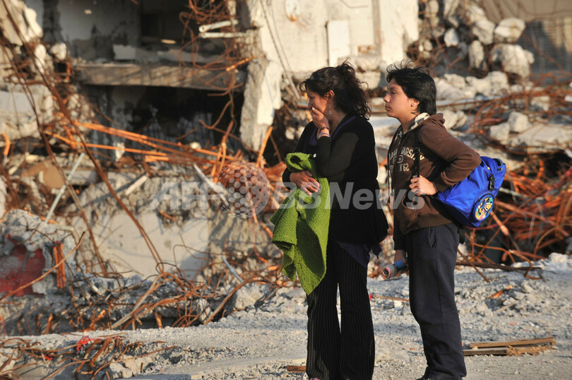 チリ大地震・津波から1年、被災地で追悼式典 進まぬ復興