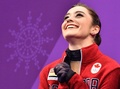 平昌冬季五輪、フィギュアスケート女子シングル・ショートプログラム（SP）の演技後に笑顔を見せるケイトリン・オズモンド（2018年2月21日撮影）。(c)AFP/Mladen ANTONOV