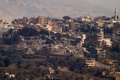 レバノン南部ヒアムで、イスラエル軍の空爆を受けがれきと化した建物群（2024年10月29日撮影）。(c)AFP