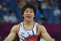 ロンドン五輪は28日、ノース・グリニッジ・アリーナ（North Greenwich Arena）で体操の男子予選が行われ、日本はミスを連発しながらも全体5位で団体決勝に進出した。

鉄棒の演技を終えた山室光史（Koji Yamamuro、2012年7月28日撮影）。(c)AFP/BEN STANSALL