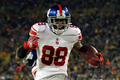 11NFLプレーオフは15日、カンファレンス準決勝が行われ、ニューヨーク・ジャイアンツ（New York Giants）はグリーンベイ・パッカーズ（Green Bay Packers）に37-20で勝利し、ナショナル・カンファレンス（NFC）決勝に進出した。

第2クォーターに37ヤードのタッチダウンパスをキャッチし、歓喜するジャイアンツのアキーム・ニックス（Hakeem Nicks、2012年1月15日撮影）。(c)AFP/Getty Images/Jamie Squire