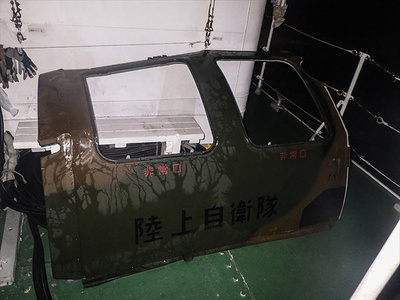 Helicopter parts found as Japan hunts for missing troops