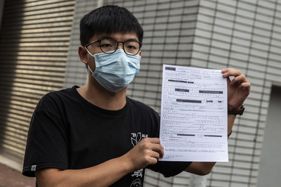 香港、収監中の黄之鋒氏を逮捕 国安法違反容疑で