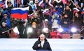 ロシアのクリミア併合から8年の関連行事で、演説するウラジーミル・プーチン大統領。モスクワのルジニキ・スタジアムで（2022年3月18日撮影）。(c)Ramil SITDIKOV / POOL / AFP