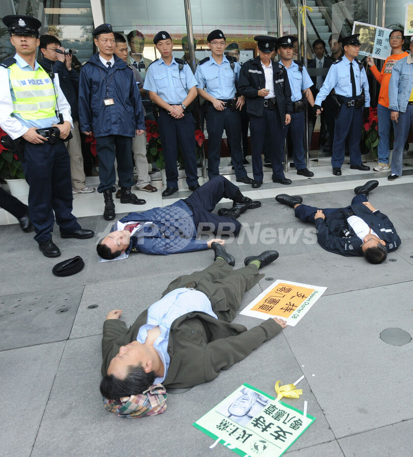 中国の改革訴えた人権活動家に懲役11年、「08憲章」起草の劉暁波氏