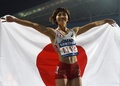 第17回アジア競技大会（17th Asian Games、Asiad）陸上女子100メートルハードル決勝。銅メダルを獲得し日本国旗を掲げる木村文子（Ayako Kimura、2014年10月1日撮影）。(c)AFP/MANAN VATSYAYANA