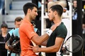 テニス、マドリード・オープン、男子シングルス準決勝。試合後に健闘をたたえ合うカルロス・アルカラス（右）とノバク・ジョコビッチ（2022年5月7日撮影）。(c)Pierre-Philippe MARCOU / AFP