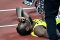 第16回世界陸上ロンドン大会、男子4×100メートルリレー決勝。負傷してトラックに倒れたジャマイカのウサイン・ボルト（2017年8月12日撮影）。(c)AFP/Kirill KUDRYAVTSEV