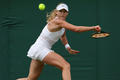 テニス、ウィンブルドン選手権、女子シングルス3回戦。リターンを打つミラ・アンドレーワ（2023年7月9日撮影）。(c)Adrian DENNIS / AFP
