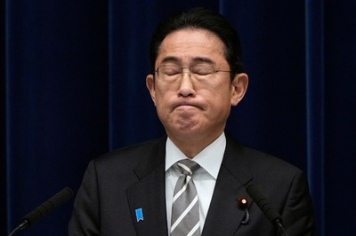 Japan PM to tackle party scandal 'like a ball of fire'