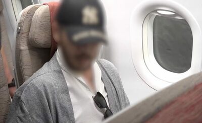 フィリピンから引き渡された韓国の“麻薬王”、機内での手錠に不満