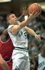 Jason Kidd of the Dallas Mavericks scores the lay-up while Washington Bullets Calbert Cheaney (L) tries to block during the first half of their NBA game in Reunion Arena in Dallas 08 December. (c)AFP/PAUL BUCK