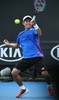 全豪オープンテニス、男子シングルス1回戦。フォアハンドを打つ西岡良仁（2017年1月17日撮影）。(c)AFP/SAEED KHAN