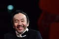 第71回ベネチア国際映画祭（Venice International Film Festival）で出品作品『野火（Nobi）』の上映会場に登場した塚本晋也（Shinya Tsukamoto）監督（2014年9月2日撮影）。(c)AFP/GABRIEL BOUYS