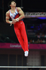 ロンドン五輪は28日、ノース・グリニッジ・アリーナ（North Greenwich Arena）で体操の男子予選が行われ、日本はミスを連発しながらも全体5位で団体決勝に進出した。

鉄棒の演技に臨む山室光史（Koji Yamamuro、2012年7月28日撮影）。(c)AFP/BEN STANSALL