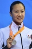 第17回アジア競技大会（17th Asian Games、Asiad）競泳女子100メートル平泳ぎ決勝。表彰台で歓喜する渡部香生子（Kanako Watanabe、2014年9月21日撮影）。(c)AFP/PHILIPPE LOPEZ
