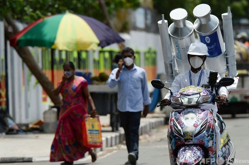 インドで製造ワクチンを背に疾走 接種呼び掛け