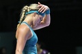 女子テニス、WTAツアー選手権（BNP Paribas WTA Championships - Singapore 2014）4日目。落胆した表情をみせるユージェニー・ブシャール（Eugenie Bouchard、2014年10月23日撮影）。(c)AFP/ROSLAN RAHMAN