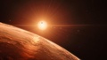 赤色矮星「TRAPPIST-1」の周りを公転する7つの惑星のうちの一つの地表を描いた想像図。欧州南天天文台（ESO）提供（2017年2月22日提供）。(c)AFP/ESO/M. Kornmesser/spaceengine.org