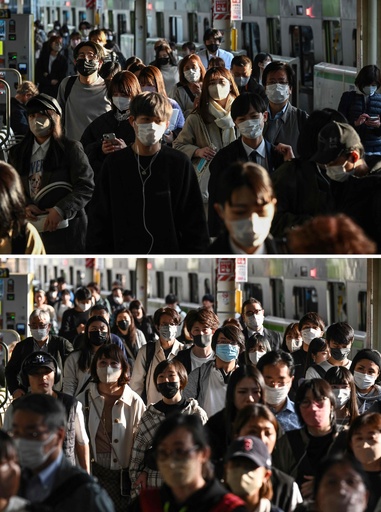 Japan residents keep their masks on weeks after guideline change