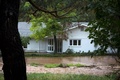 米コロラド州のボルダーの住宅に迫る洪水（2013年9月12日撮影）。(c)AFP/Getty Images/Dana Romanoff