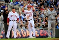 第85回MLBオールスターゲーム（85th All-Star Game）。先制の三塁打を放ち喜ぶア・リーグのマイク・トラウト（Mike Trout、中央、2014年7月15日撮影）。(c)AFP/Getty Images/Rob Carr