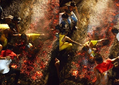 燃え盛る石炭の上に子ども落とす、ヒンズー教儀式で インド