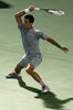 ドバイ・テニス選手権（Dubai Duty Free Tennis Championships 2014）、男子シングルス準決勝。リターンを打つノバク・ジョコビッチ（Novak Djokovic、2014年2月28日撮影）。(c)AFP/KARIM SAHIB