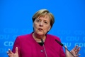 ドイツの首都ベルリンのキリスト教民主同盟本部で記者会見するアンゲラ・メルケル首相（2018年10月29日撮影）。(c)Tobias SCHWARZ / AFP
