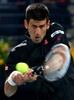 ドバイ・テニス選手権（Dubai Duty Free Tennis Championships 2014）、男子シングルス1回戦。リターンを打つノバク・ジョコビッチ（Novak Djokovic、2014年2月25日撮影）。(c)AFP/MARWAN NAAMANI