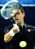 ドバイ・テニス選手権（Dubai Duty Free Tennis Championships 2014）、男子シングルス1回戦。リターンを打つノバク・ジョコビッチ（Novak Djokovic、2014年2月25日撮影）。(c)AFP/MARWAN NAAMANI
