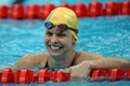 北京五輪・競泳女子100メートルバタフライを制し笑顔を浮かべるオーストラリアのリスベス・トリケット。（2008年8月11日撮影）(c)AFP/MARTIN BUREAU